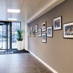 A photo of our new Leeds office’s reception area, showing the community gallery space