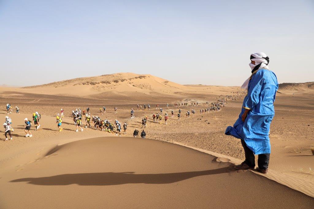 Climbing up a sand dune during the Marathon des Sables