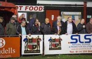 A crowd watches Sheffield FC playing