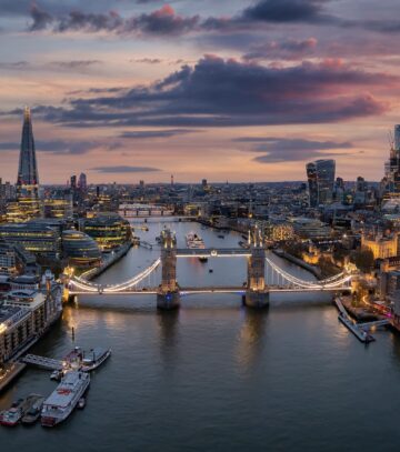 Aerial,View,Of,The,Illuminated,Tower,Bridge,And,London,Skyline