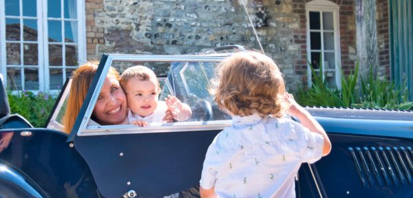 A,Family,Enjoys,Their,New,Classic,Car,In,The,Countryside