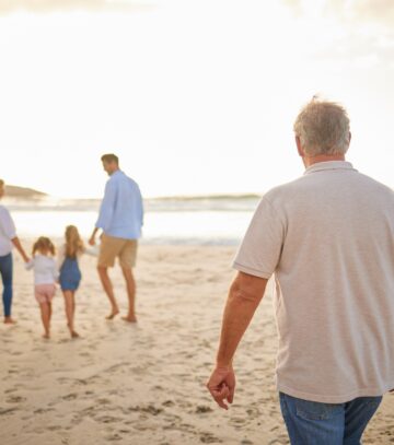People,,Family,And,Generations,With,Walking,In,Beach,For,Bonding,