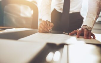 Man signing documents