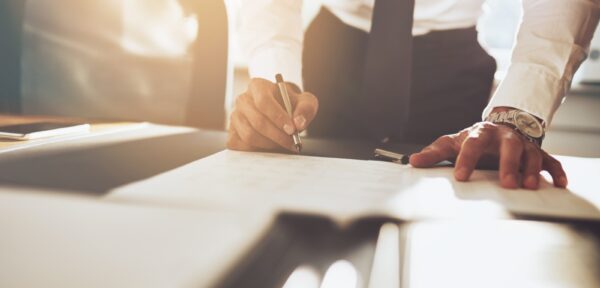 Man signing documents