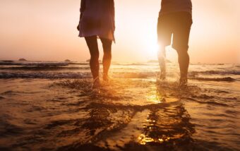 People walking through shallow water