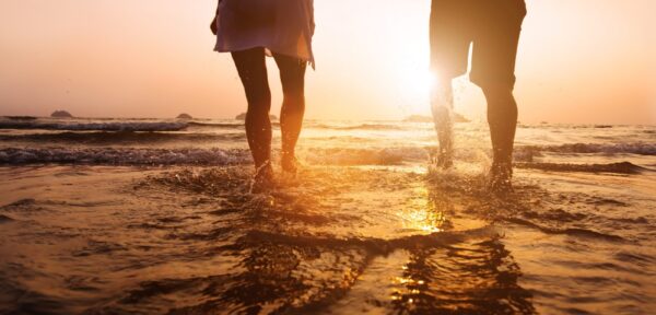 People walking through shallow water