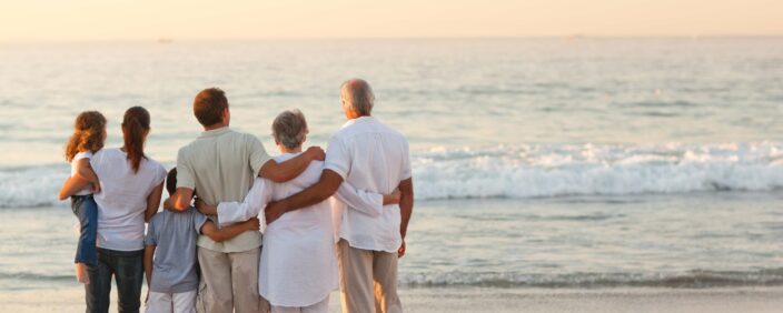 Intergenerational family on beach