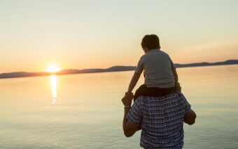 Boy on father's shoulders