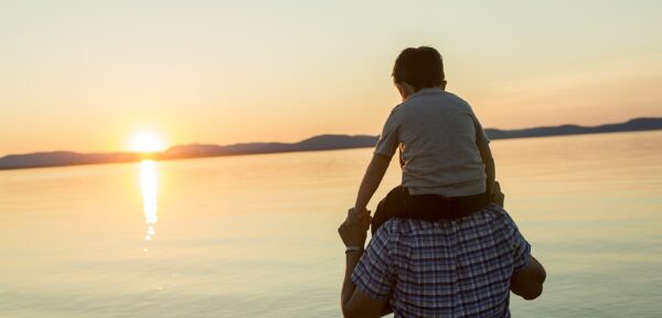 Boy on father's shoulders