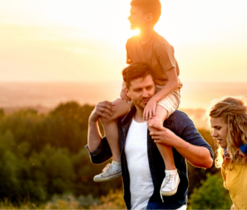 family hiking sunset