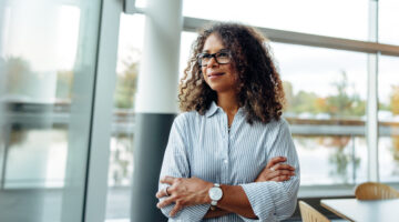 Woman,Entrepreneur,Standing,Beside,A,Window,In,Office.,Mature,Woman